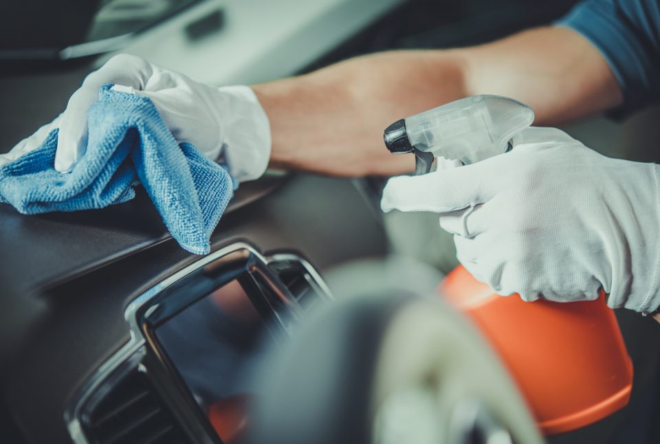 Person cleaning the interior of their vehicle.