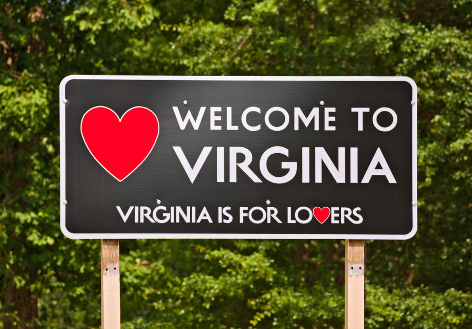 Virginia is for Lovers, state motto and welcome sign on a billboard surrounded by trees