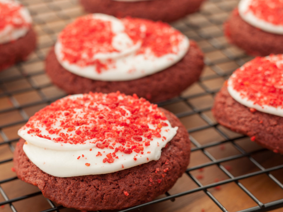 Red velvet shortbread cookies on cooling rack