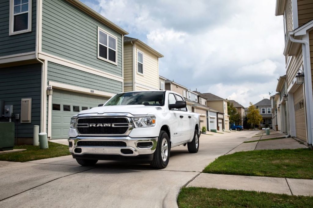 white RAM truck parked in neighborhood