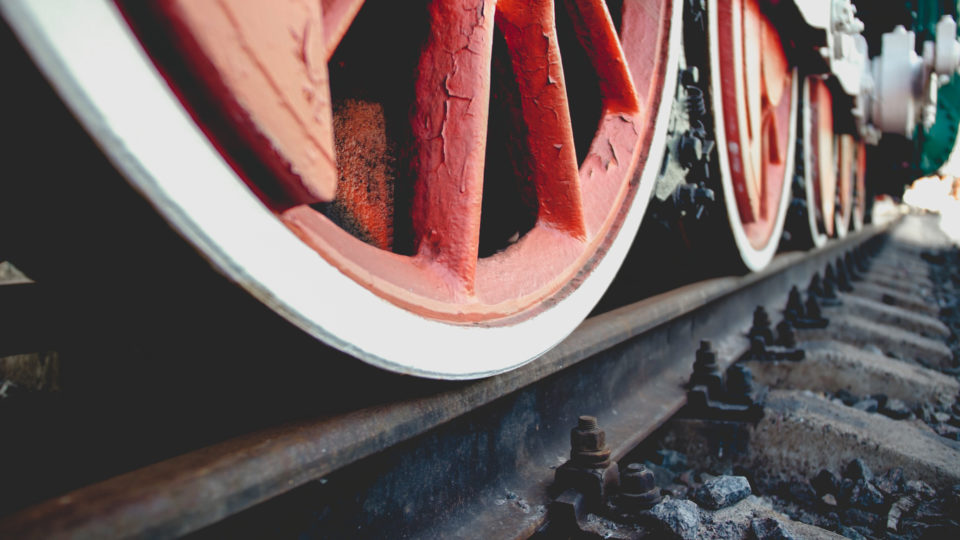 Closeup toned photo of vintage steam train locomotive on railroad station
