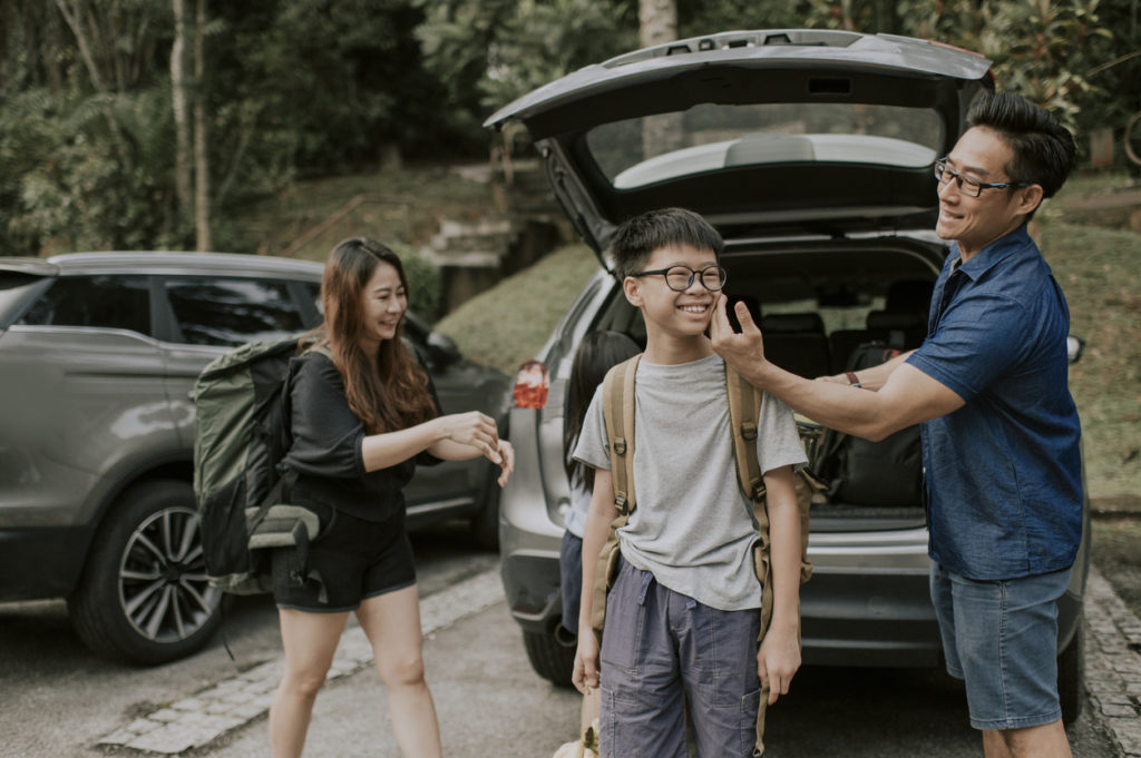 Family loading the car for a road trip