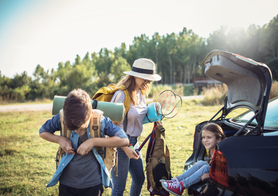 Happy Family Enjoying picnic and Camping