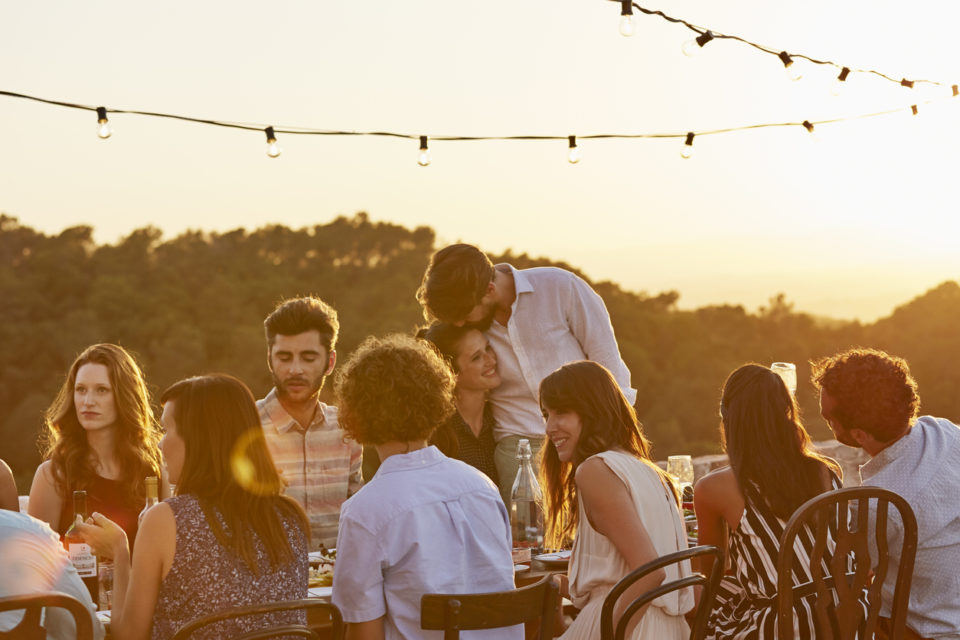 Friends enjoying at dinner party