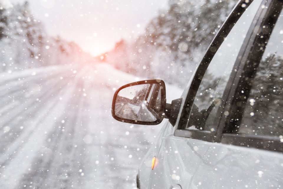 The winter road with car