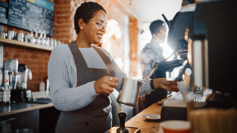 Female Barista making a drink