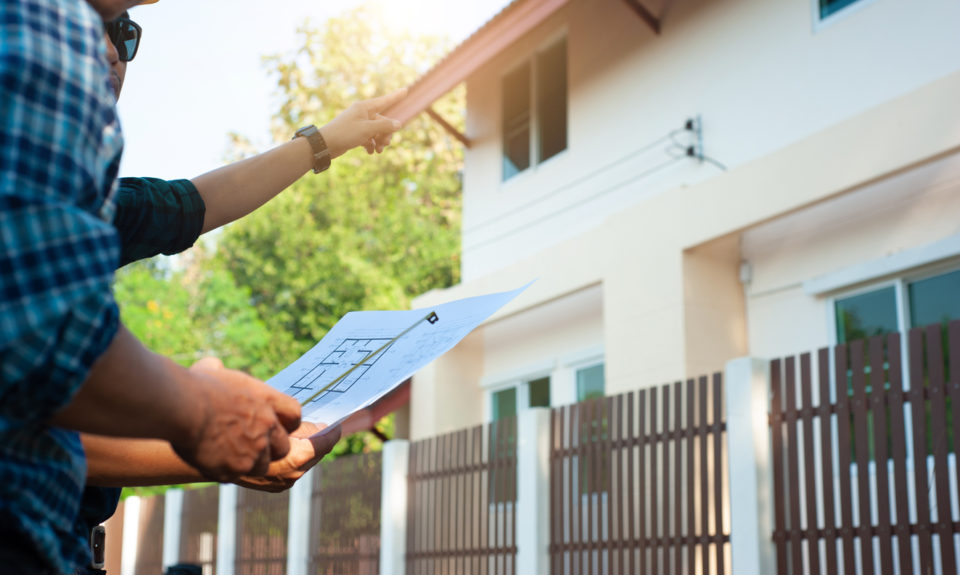 contractor examining house