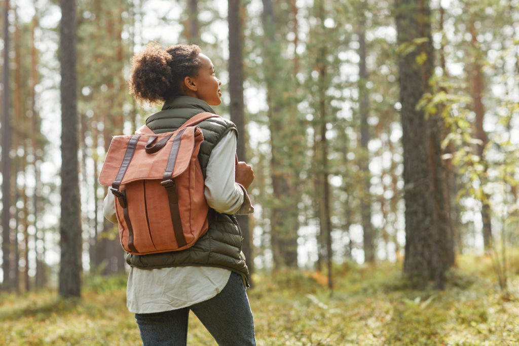 Young Woman with Backpack Outdoors