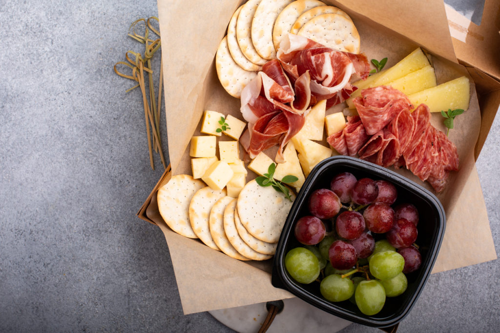 Cheese and charcuterie board to go in a box