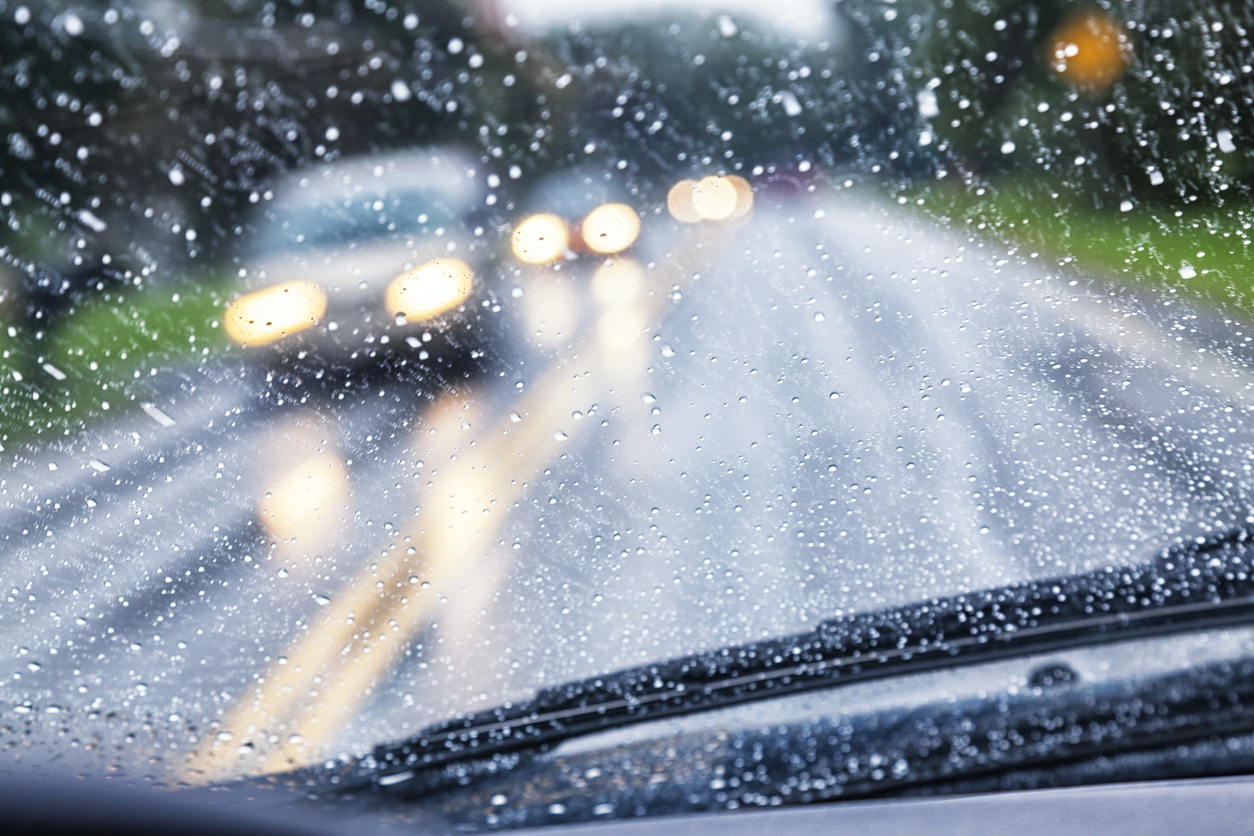 Highway Driver POV Through Raindrop Car Windshield During Rain Storm