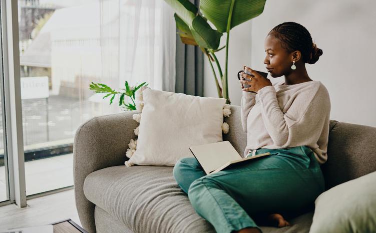 Shot of a young woman relaxing on the couch at home